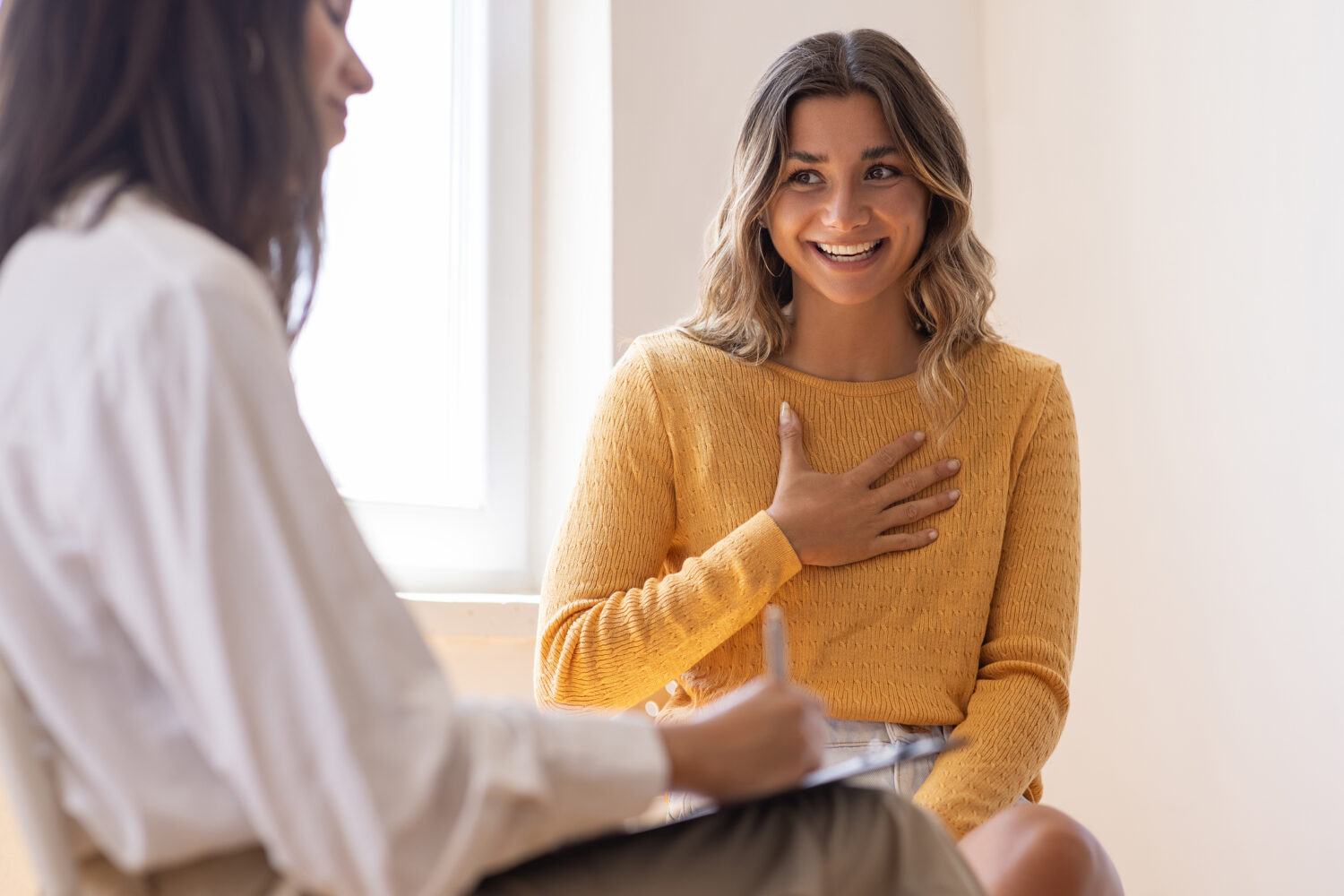 woman at clinic talking to a health care provider